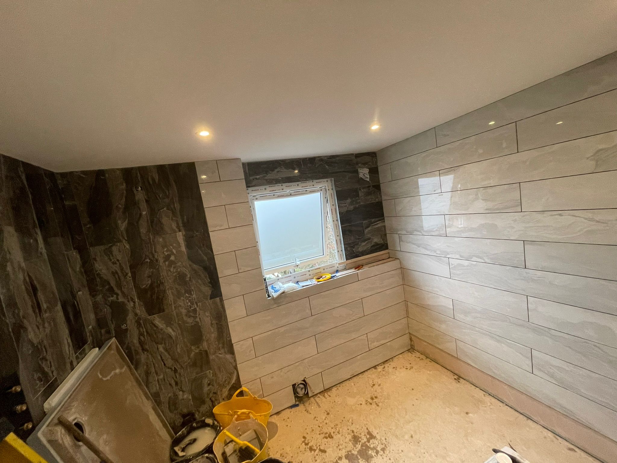 Bathroom tiling in progress